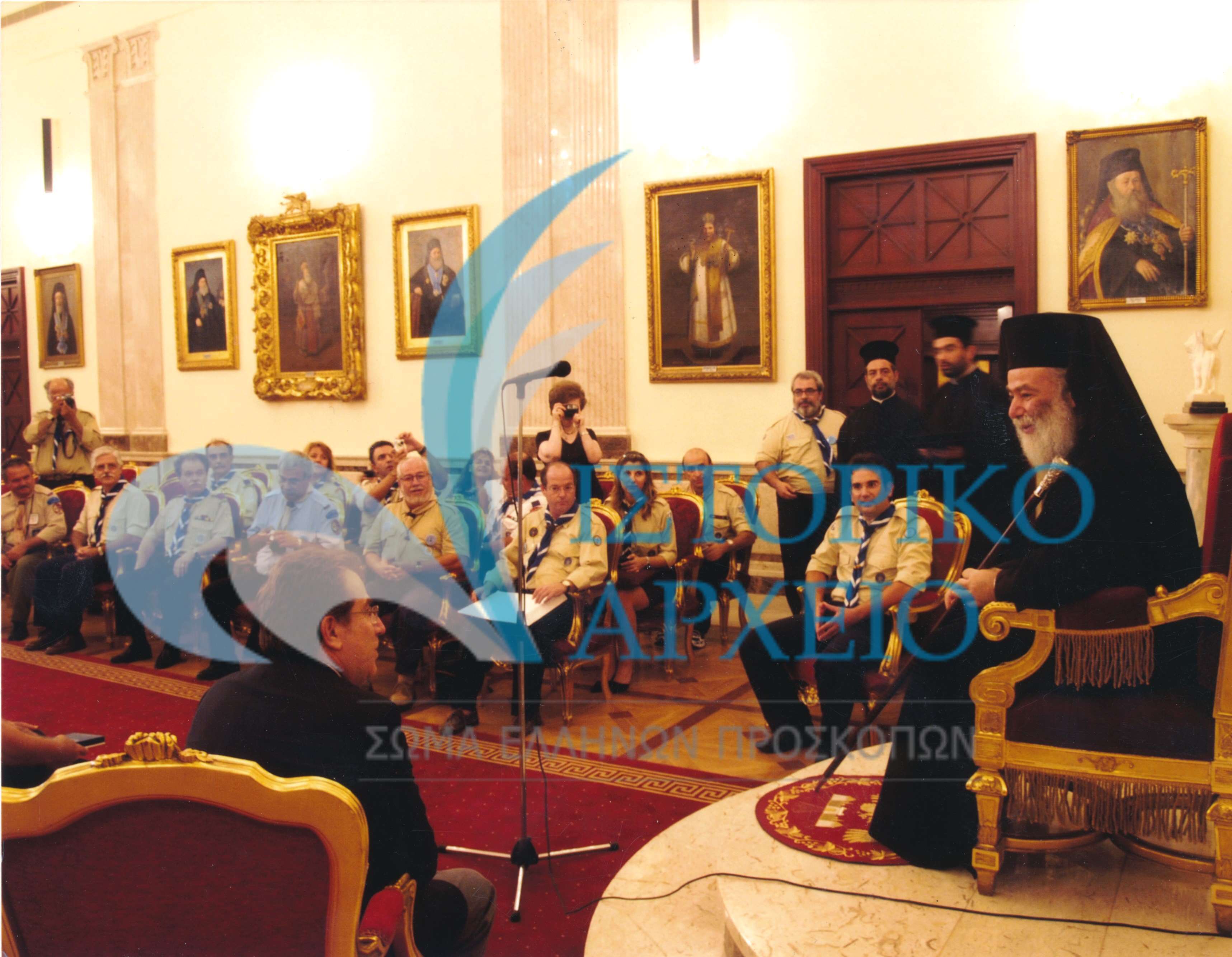 Από την απονομή του μεταλλείου Αργυρού Φοίνικα στον Πατριάρχη Αλεξανδρείας & Πάσης Αφρικής Θεόδωρο Β' το 2006. Διακρίνονται: Χρ. Σταθόπουλος - Πρόεδρος ΔΣ ΣΕΠ, Ε. Μπακογιάννης - Γενικός Γραμματέας ΣΕΠ, Ν. Χαραλαμπόπουλος - Οικονομικός Σύμβουλος.